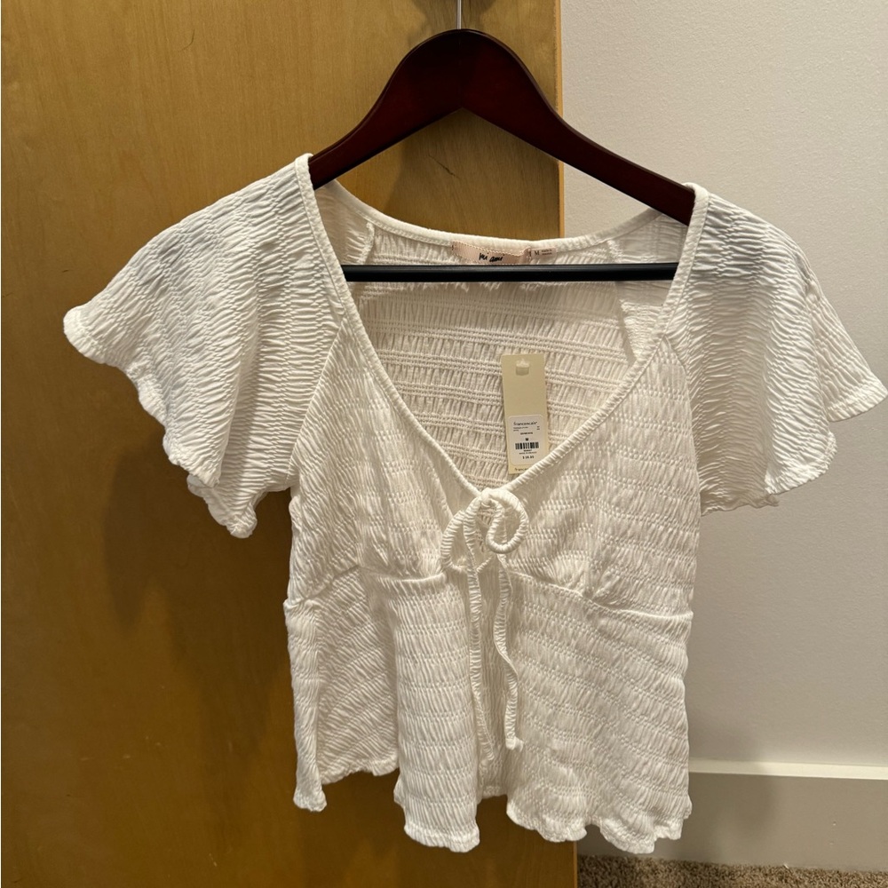NWT size medium Francesca’s short sleeve shirt.